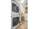 A practical laundry area with stacked washer/dryer and storage cabinets at 546 Midway Dr # B, Ocala, FL 34472