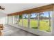Bright sun room with picturesque views of the lush, green landscape beyond at 546 Midway Dr # B, Ocala, FL 34472