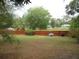 Expansive backyard featuring a lush lawn and a privacy fence at 5949 Se 164Th Ct, Ocklawaha, FL 32179