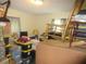 Bedroom with rocking chair, boxes and minimal furniture at 5949 Se 164Th Ct, Ocklawaha, FL 32179