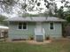 Charming single-story home featuring a landscaped front yard, inviting entrance, and neutral exterior color at 5949 Se 164Th Ct, Ocklawaha, FL 32179