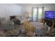Bright living room with sofa, wooden floors, and lots of natural light at 5949 Se 164Th Ct, Ocklawaha, FL 32179