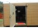 Exterior shot of the shed with open door on the property at 5949 Se 164Th Ct, Ocklawaha, FL 32179