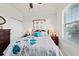 Bright bedroom with a large window, dresser, and closet, offering a cozy and functional space at 6394 Sw 97Th Terrace Rd, Ocala, FL 34481