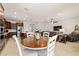 Open floor plan view from the dining room into the kitchen and living room at 6394 Sw 97Th Terrace Rd, Ocala, FL 34481
