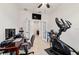 Office space featuring French doors, an exercise machine, and a functional workspace at 6394 Sw 97Th Terrace Rd, Ocala, FL 34481