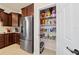 Walk-in pantry featuring wire shelving and plenty of storage space at 6394 Sw 97Th Terrace Rd, Ocala, FL 34481