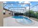 Inviting screened-in pool with spa, perfect for relaxation and outdoor entertainment at 6394 Sw 97Th Terrace Rd, Ocala, FL 34481