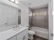 Well-lit bathroom with a vanity, tub, and shower with modern fixtures at 6689 Nw 61St St, Ocala, FL 34482