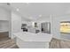 Contemporary kitchen features white cabinetry, stainless appliances, and stone countertops at 6689 Nw 61St St, Ocala, FL 34482