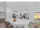 Bright kitchen featuring modern appliances, sleek white cabinetry, and a spacious island at 6689 Nw 61St St, Ocala, FL 34482