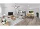 Inviting living room with an open concept, light wood floors, and neutral-toned furnishings at 6689 Nw 61St St, Ocala, FL 34482