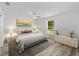 Relaxing main bedroom features soft colors, ceiling fan, and natural light at 6689 Nw 61St St, Ocala, FL 34482