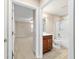 Bathroom with wood look tile floor, shower and bath combo at 6868 Sw 95Th Cir, Ocala, FL 34481
