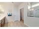 Bright bathroom boasts a walk-in shower, wood-look tile floor, and a spacious vanity at 6868 Sw 95Th Cir, Ocala, FL 34481