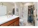 Bathroom featuring wood cabinet and shower tub combination with curtain at 6868 Sw 95Th Cir, Ocala, FL 34481