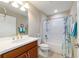 Well-lit bathroom featuring a vanity with solid surface counter, a tub, and neutral decor at 6868 Sw 95Th Cir, Ocala, FL 34481