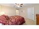 Inviting bedroom with natural lighting, ceiling fan and carpet flooring at 6868 Sw 95Th Cir, Ocala, FL 34481