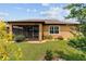 Rear exterior view showcasing a screened patio and landscaped yard at 6868 Sw 95Th Cir, Ocala, FL 34481