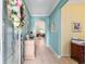 Inviting foyer featuring archway, decorative floral wreath and decor, leading to a light-filled living space at 6868 Sw 95Th Cir, Ocala, FL 34481