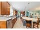 Spacious kitchen with ample cabinet space, stainless steel appliances, and a large center island at 6868 Sw 95Th Cir, Ocala, FL 34481