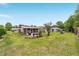 Expansive backyard with a well-maintained lawn and a screened porch, offering ample space for recreation at 8140 Sw 109Th Street Rd, Ocala, FL 34481