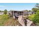 Charming home backyard features a screened porch and patio area, perfect for outdoor entertaining at 8140 Sw 109Th Street Rd, Ocala, FL 34481