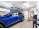 The garage features a clean epoxy floor, overhead storage, and ample storage space at 8140 Sw 109Th Street Rd, Ocala, FL 34481