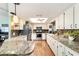 Charming kitchen with granite countertops, stainless steel appliances, and ample cabinet space at 8140 Sw 109Th Street Rd, Ocala, FL 34481