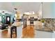 Bright kitchen featuring granite counters, stainless steel appliances, and a breakfast bar at 8140 Sw 109Th Street Rd, Ocala, FL 34481