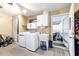 A laundry room featuring a washer, dryer, utility sink, and extra storage space at 8140 Sw 109Th Street Rd, Ocala, FL 34481