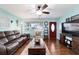 Bright living room with hardwood floors and comfortable furniture, perfect for relaxing at 8140 Sw 109Th Street Rd, Ocala, FL 34481