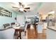 Open concept living and dining area boasts hardwood floors, ceiling fans and plenty of natural light at 8140 Sw 109Th Street Rd, Ocala, FL 34481