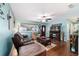 Spacious living room featuring wood floors, stylish decor, and ample seating at 8140 Sw 109Th Street Rd, Ocala, FL 34481