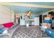Bright sunroom with ample natural light, comfortable seating, and a convenient kitchenette at 8140 Sw 109Th Street Rd, Ocala, FL 34481