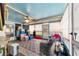 Bright sunroom with ample natural light, comfortable seating, and a ceiling fan for comfortable living at 8140 Sw 109Th Street Rd, Ocala, FL 34481