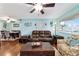 Spacious living room with hardwood floors and comfortable leather sofa at 8140 Sw 109Th Street Rd, Ocala, FL 34481