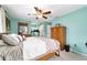 Spacious bedroom featuring an attached area, wood furnishings, and a ceiling fan at 8140 Sw 109Th Street Rd, Ocala, FL 34481