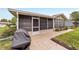 Covered and screened lanai with access to the backyard, perfect for outdoor entertaining at 8140 Sw 109Th Street Rd, Ocala, FL 34481
