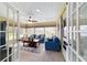 Cozy sunroom with multiple windows, comfortable seating, and a ceiling fan at 8140 Sw 109Th Street Rd, Ocala, FL 34481