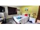 Cozy bedroom with bright walls, a queen-sized bed, and coordinated decor at 8244 Sw 106Th Pl, Ocala, FL 34481