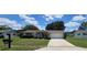 Well-maintained home with an attached garage, neat lawn, and welcoming front porch and entry at 8244 Sw 106Th Pl, Ocala, FL 34481