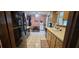 Well-lit kitchen featuring white tile flooring, wood cabinetry, and stainless steel appliances at 8244 Sw 106Th Pl, Ocala, FL 34481