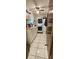 Neat laundry area featuring a stacked washer and dryer unit, and storage cabinets at 8244 Sw 106Th Pl, Ocala, FL 34481