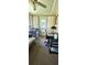 Versatile sunroom used as an office space with a desk and additional seating at 8244 Sw 106Th Pl, Ocala, FL 34481