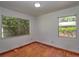 A standard room featuring hardwood floors and dual windows at 834 Ne 10Th Ave, Ocala, FL 34470