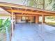 Covered carport featuring concrete slab at 834 Ne 10Th Ave, Ocala, FL 34470