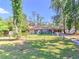 Charming single-story home featuring a well-maintained lawn and classic ranch-style architecture at 834 Ne 10Th Ave, Ocala, FL 34470