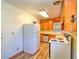A bright kitchen equipped with updated appliances, traditional wood cabinets, and ample counter space at 834 Ne 10Th Ave, Ocala, FL 34470