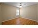 Neutral bedroom features a ceiling fan, wood floors and lots of natural light at 8617 Se 141St Street Rd, Summerfield, FL 34491
